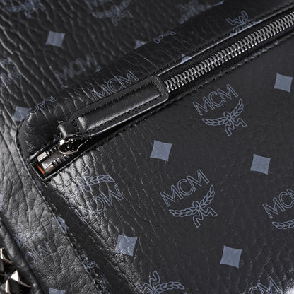 MCM Stark Visetos Medium Backpack – Black Monogram with Studded Detailing